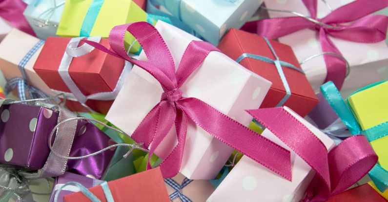 Gift Boxes - Close-up Photo of Assorted-colored Gift Boxes