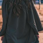 Graduation Cap - Woman in Black Long Sleeve Dress Standing on Brown Concrete Pathway