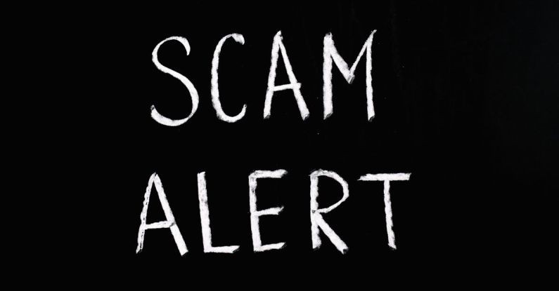 Fraud Alert - Scam Alert Letting Text on Black Background