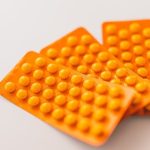 Allergy Relief - Orange packages of medications on table