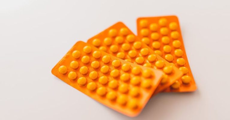 Allergy Relief - Orange packages of medications on table