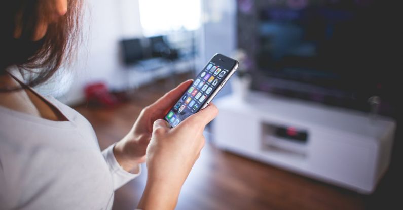 Smart Home - Woman Wearing White V Neck Shirt Using Space Gray Iphone 6