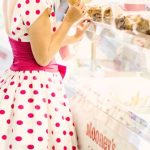 Vintage Dress - Woman Standing Near Display Counter Inside Establishment