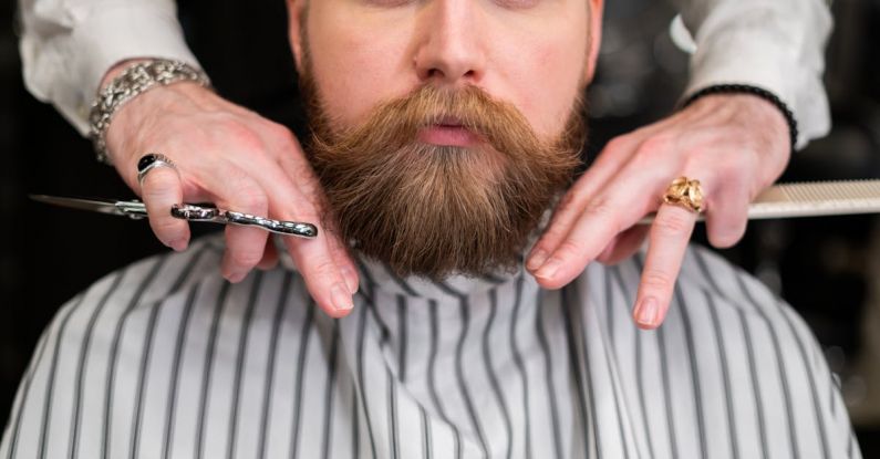 Beard Grooming - Man in White and Gray Pinstripe Having a Haircut