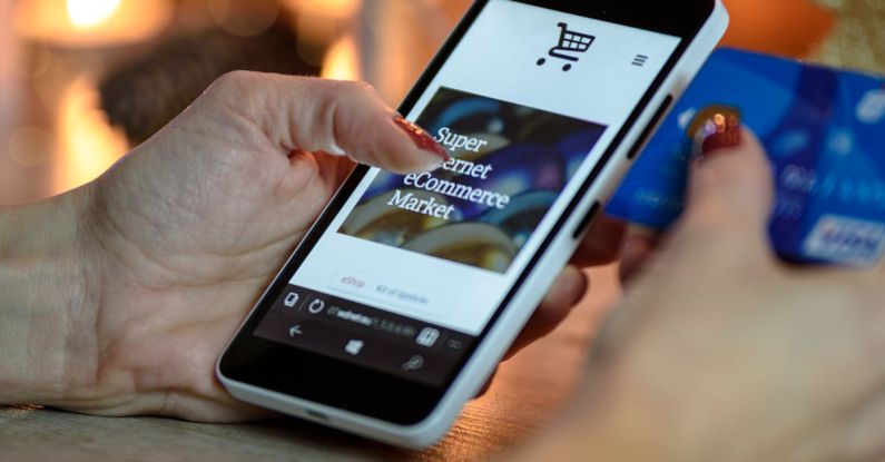 Online Shopping - Person Using Black And White Smartphone and Holding Blue Card