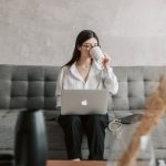 Productivity Software - Woman Drinking Coffee While Working With Laptop