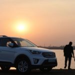 Family Car - Silhouette of Man and Child Near White Hyundai Tucson Suv during Golden Hour