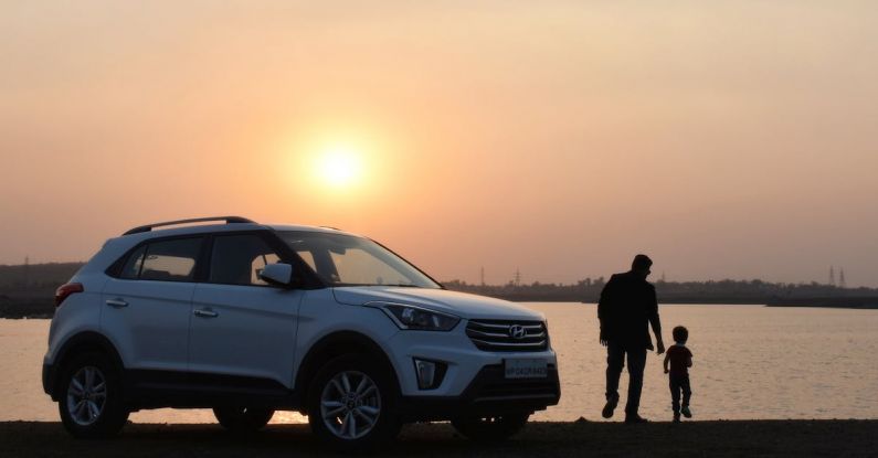 Family Car - Silhouette of Man and Child Near White Hyundai Tucson Suv during Golden Hour