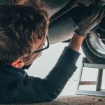 Car Mechanic - Man Fixing Vehicle Engine