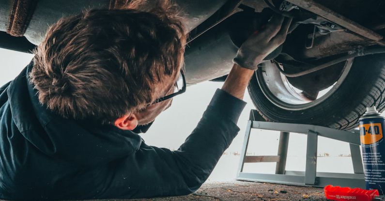 Car Mechanic - Man Fixing Vehicle Engine