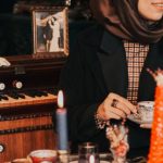 Cluttered Room - Hijabi Woman Sitting in Cluttered Room by Glass Table